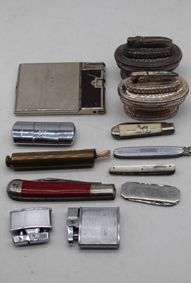 Lot 494 - A box of vintage lighters and pocket knives