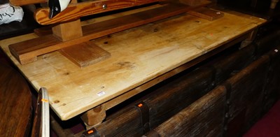Lot 1386 - A pine long farmhouse kitchen table, raised on...