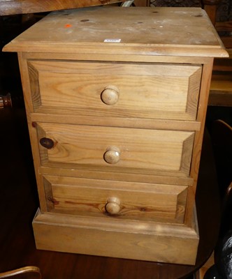 Lot 1399 - Two modern pine three-drawer bedside chests