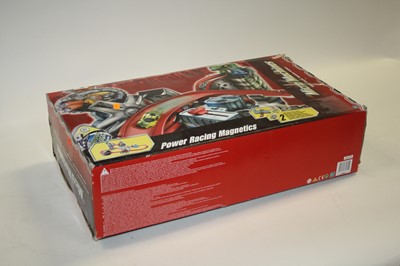 Lot 683 - A boxed Micro Machines Power Racing magnetic...