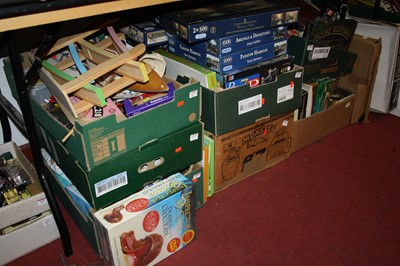 Lot 704 - Seven boxes of mixed toys including jigsaws,...