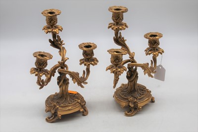 Lot 603 - A pair of gilt metal table candle sticks in...
