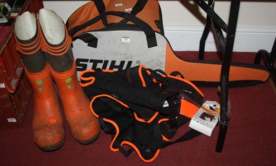 Lot 740 - A Stihl chain saw, together with chain saw...