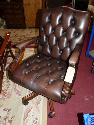 Lot 1412 - A contemporary mahogany, tan leather buttoned...