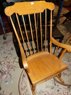 Lot 1415 - A contemporary beech stick back rocking...