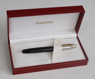 Lot 140 - A cased Sheaffer Legacy fountain pen, in black...