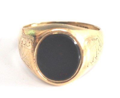 Lot 2514 - A 9ct yellow gold oval bloodstone set signet...