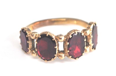 Lot 2511 - A yellow metal Georgian style garnet dress...