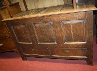 Lot 1205 - An 18th century joined oak three-panelled...
