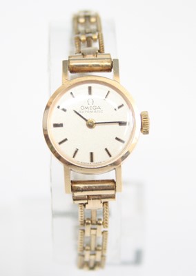 Lot 2524 - A lady's 9ct yellow gold Omega automatic...