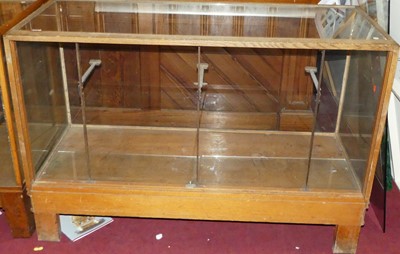 Lot 1119 - A mid-20th century blond oak shop display...