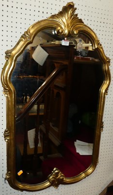 Lot 1121 - A contemporary floral gilt framed wall mirror,...