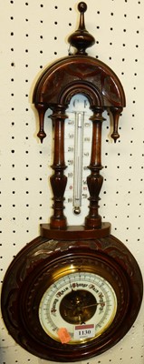 Lot 1130 - An Edwardian floral relief carved walnut two...