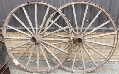 Lot 1146 - A pair of wrought iron and timber wagon wheels...