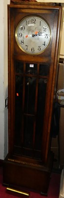 Lot 1150 - A 1930s oak long case clock by Enfield, having...