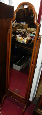 Lot 1151 - A walnut shaped arch top cheval mirror