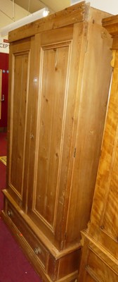 Lot 1155 - A pine double door wardrobe, having single...