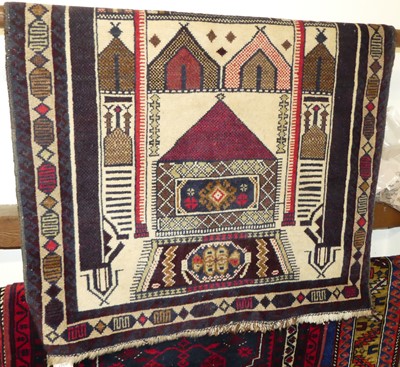 Lot 1157 - A Persian woollen cream ground prayer rug, 130...