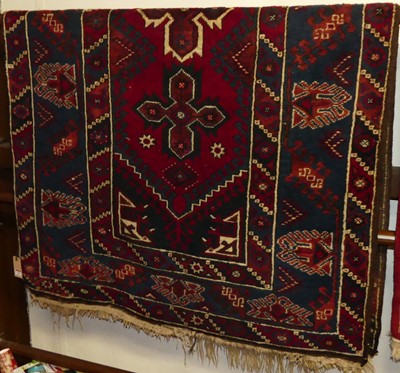 Lot 1161 - A Turkish woollen red ground Shiraz rug, 200 x...