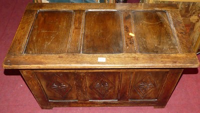 Lot 1178 - A joined oak hinge top three panelled blanket...