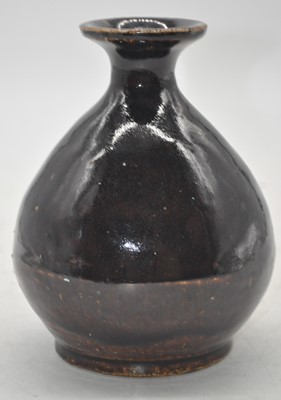 Lot 170 - A Chinese brown glazed vase, the flared rim...