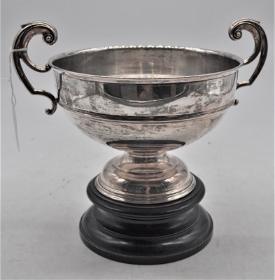 Lot 202 - An Edward VII silver trophy cup, flanked by...