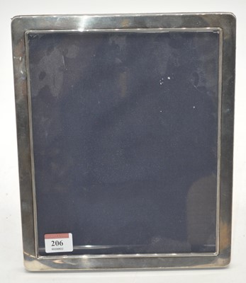 Lot 206 - A modern silver clad easel photograph frame,...