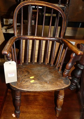 Lot 1185 - An elm and fruitwood child's stickback Windsor...