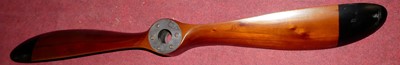 Lot 1186 - A small mahogany and brass propellor blade,...