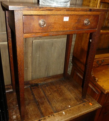 Lot 1204 - An early 20th century oak single drawer side...
