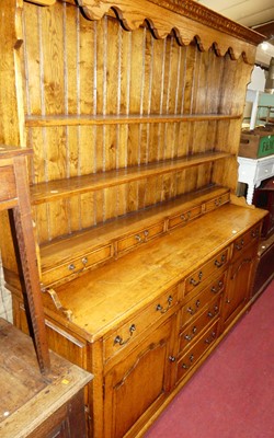 Lot 1207 - A joined oak Welsh dresser made by Brights of...