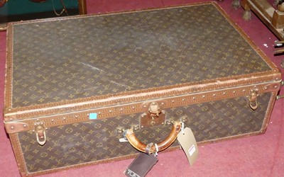 Lot 1219 - A canvas leather and brass bound travelling...