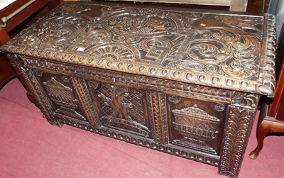 Lot 1233 - A circa 1900 profusely relief carved oak three-...