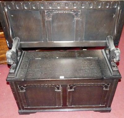Lot 1254 - An ebonised and moulded oak fold-over monks...