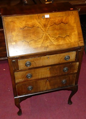 Lot 1256 - A 1930s figured walnut and cross banded...