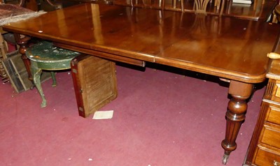 Lot 1273 - An oak round cornered extending dining table,...