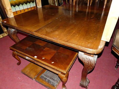 Lot 1282 - An Edwardian walnut round cornered extending...