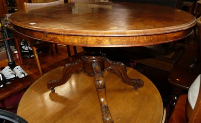 Lot 1286 - A mid-Victorian figured walnut oval tilt-top...