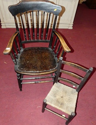 Lot 1304 - An early 20th century stained beech stickback...