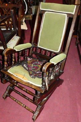 Lot 1313 - An American stained beech rocking armchair,...