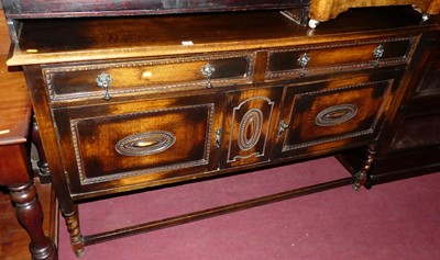 Lot 1328 - An early 20th century moulded oak double door...