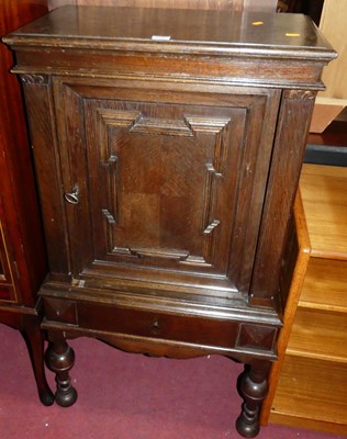 Lot 1338 - An early 20th century geometric moulded oak...