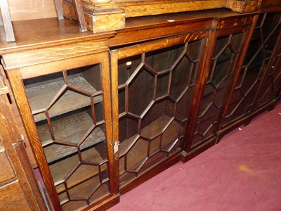 Lot 1347 - A 1930s oak inverted breakfront astragal...
