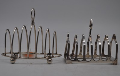 Lot 229 - A George V silver toast rack having six arched...