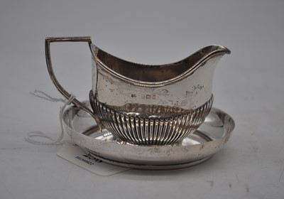 Lot 238 - An Edwardian silver cream jug of half...