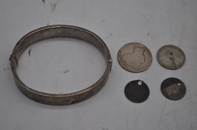 Lot 243 - A George V silver hinged bangle having foliate...