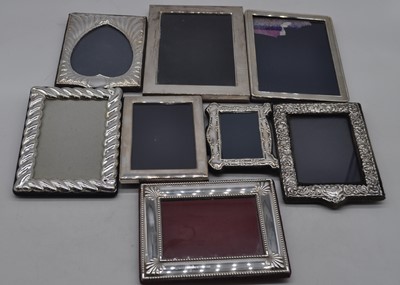 Lot 211 - A modern silver clad easel photo frame of...