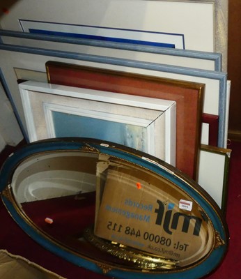 Lot 1093 - A gilt framed and bevelled oval wall mirror;...