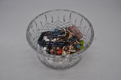 Lot 275 - A cut glass bowl containing a small collection...
