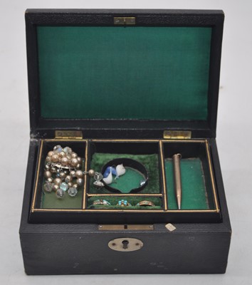 Lot 296 - A leather clad jewellery box and contents to...